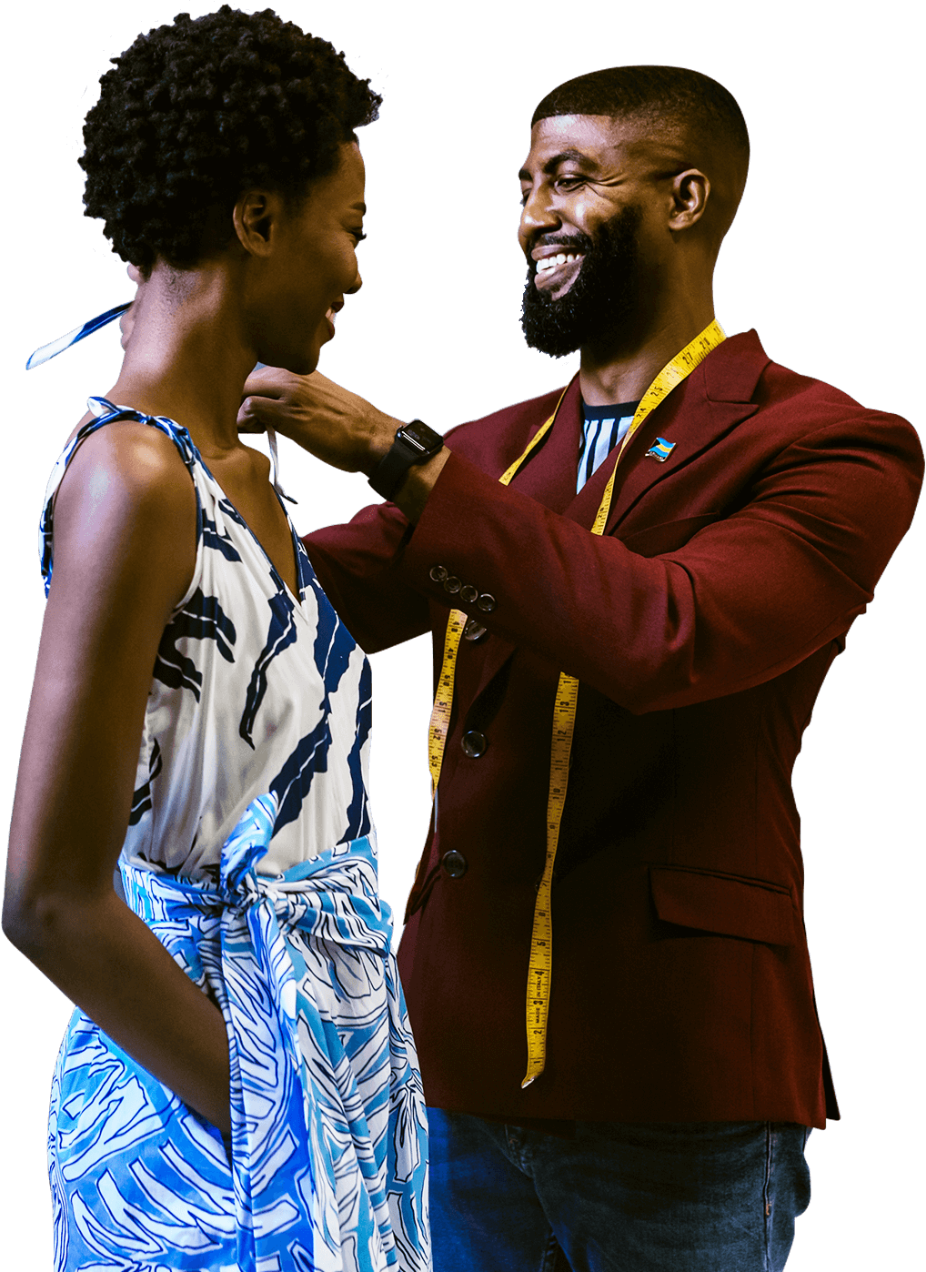 Theo Elyett adjusting a model's dress strap